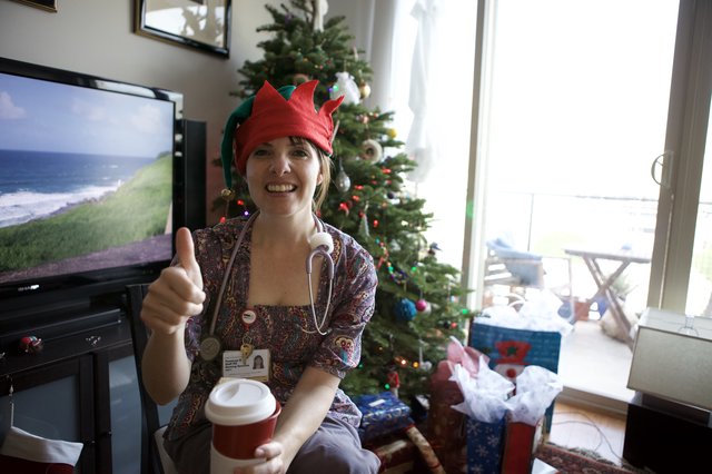 Festive Nurse Elf Celebrates Christmas with Thumbs Up