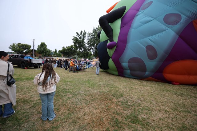 Giant Character Balloon Being Inflated at Festival