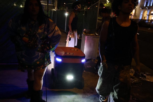 Autonomous Delivery Robot Navigates Night Festival Crowd