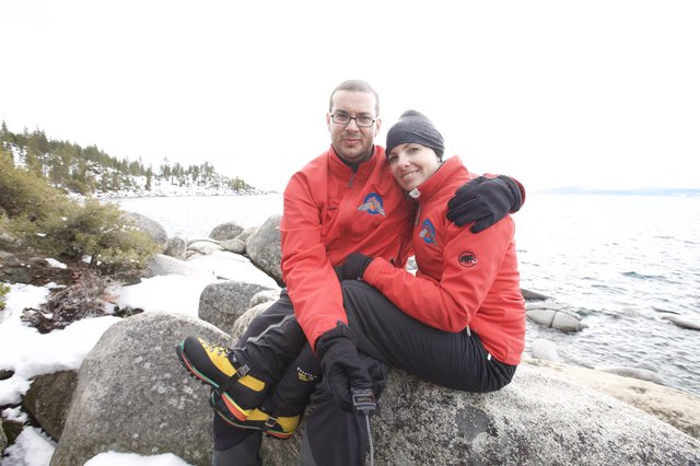 Couple Embracing on Snowy Lake Tahoe Shoreline