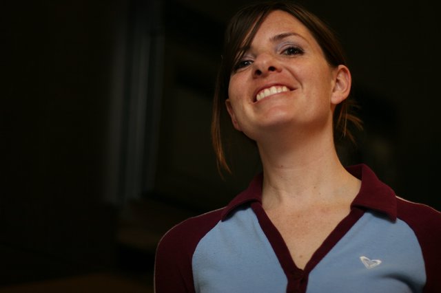 Joyful Woman Smiling Upward in Warm Light