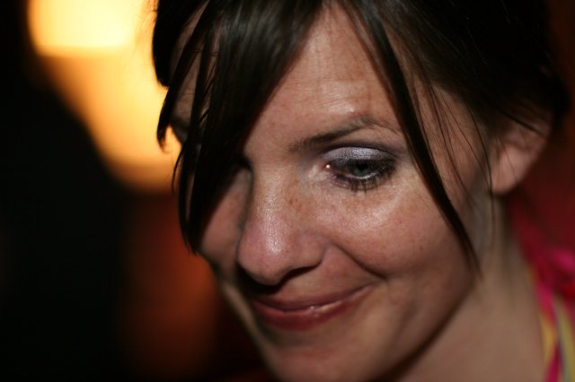 Intimate Close-Up Portrait of Smiling Woman with Dark Hair