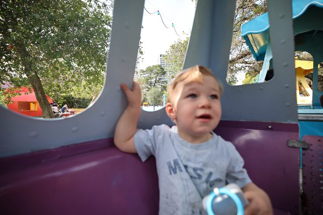Toddler Playing at Colorful Fantasyland Playground