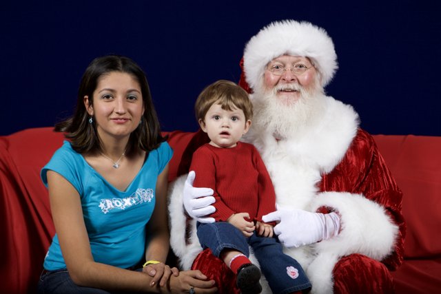 Christmas Cheer with Santa Claus, Woman, and Child