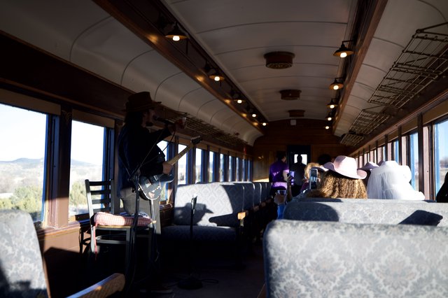 Vintage Train Car Interior with Scenic Mountain Views