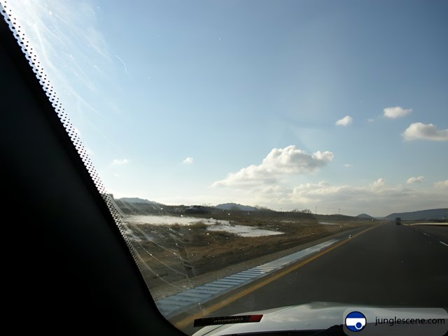 Highway Drive Through Snowy Land