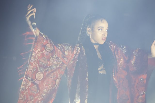 FKA Twigs Shines Bright in Red Robe and Black Jacket on Stage
