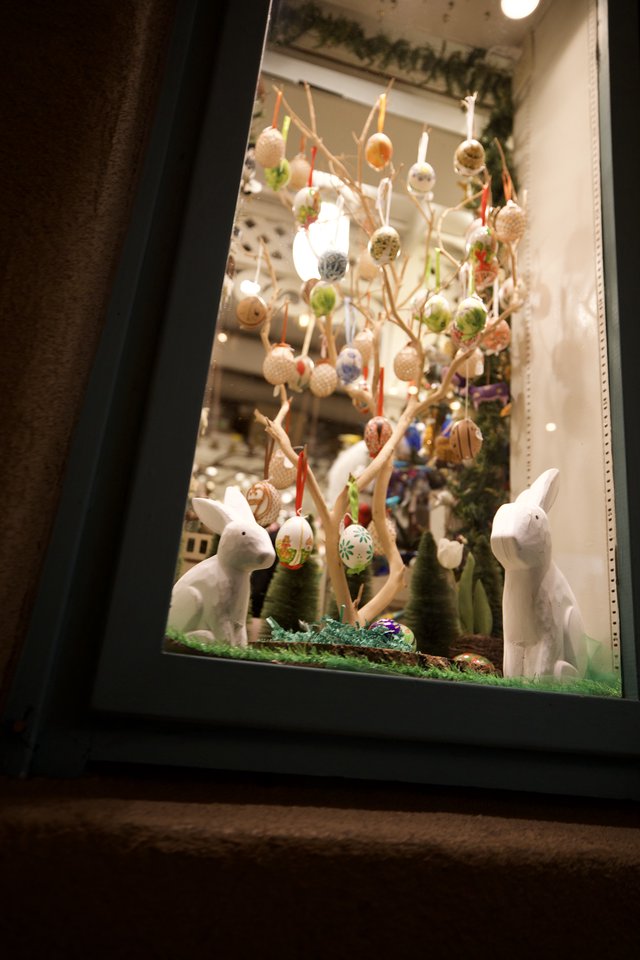 Easter Window Display with Decorated Eggs and Rabbits