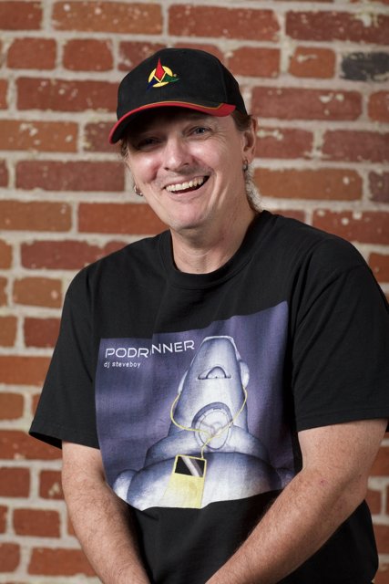 Smiling Man in Black Hat and T-Shirt