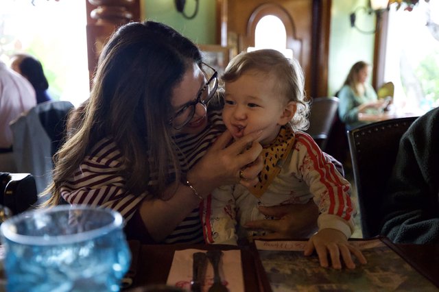 Mother and Child Sharing Sweet Moment at Restaurant
