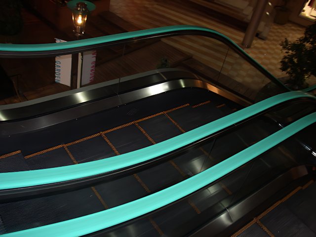 Green Striped Escalator in Modern Housing Complex