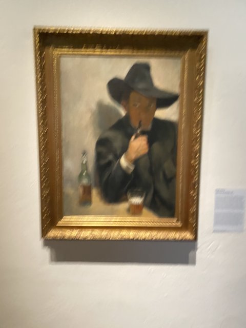 Man in a Hat with a Bottle