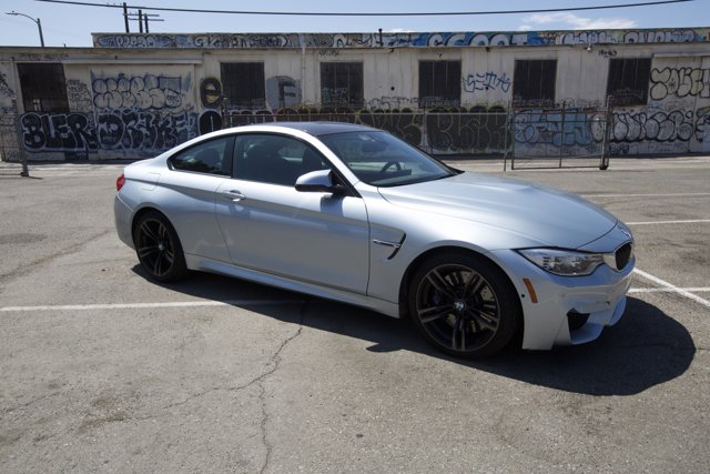 Parked BMW M4 Coupe Against a Wall