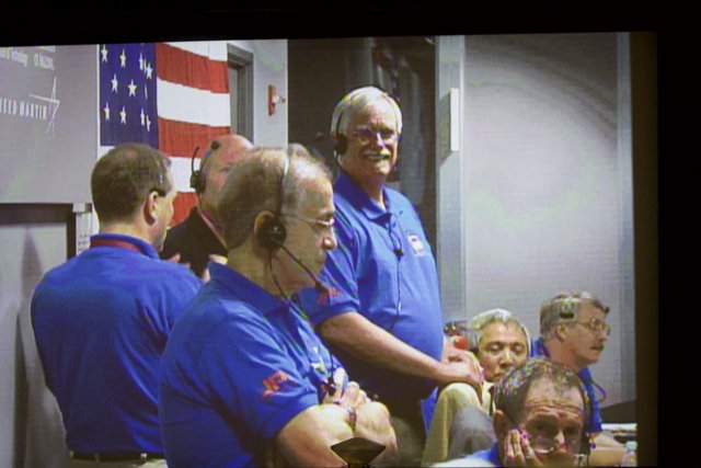 Group of Men in Blue Shirts at Phoenix Touchdown