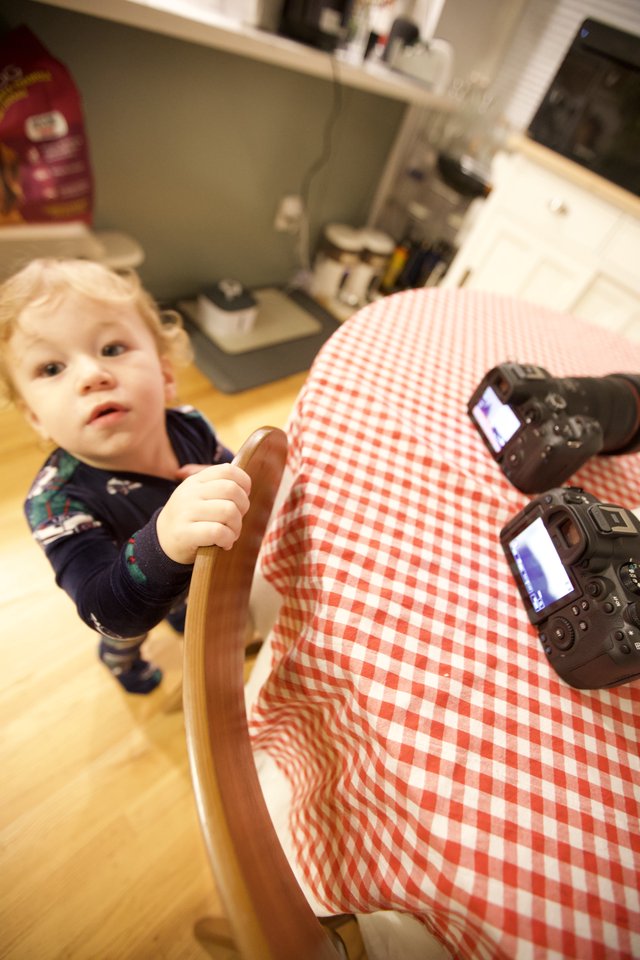 Curious Toddler Helper in Kitchen During Christmas Morning