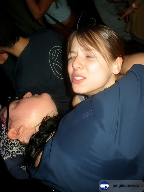Two Women Embrace at a Nightclub