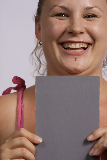 Grinning Girl with Paper