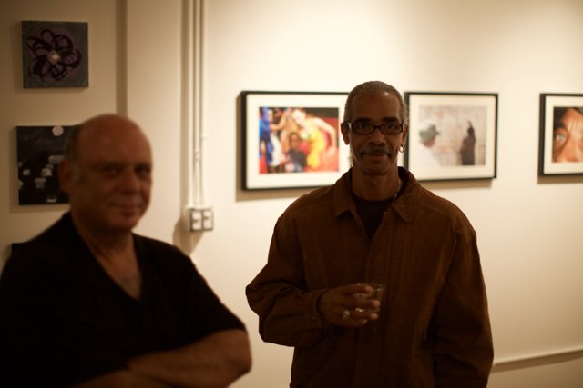 Two Men Admiring Art in Gallery