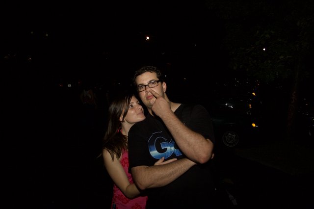 Couple Poses Playfully on a Summer Night Out