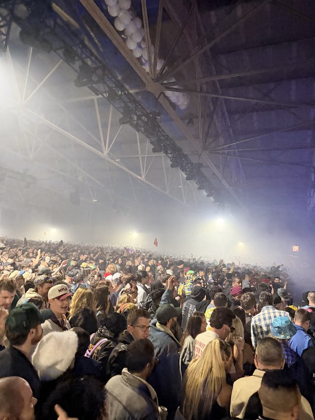 Massive Indoor Concert Crowd Under Dramatic Stage Lighting