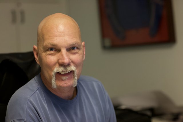 Smiling Bald Man with a Mustache