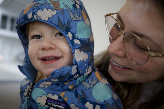 Joyful Winter Moment: Mother and Child Bonding