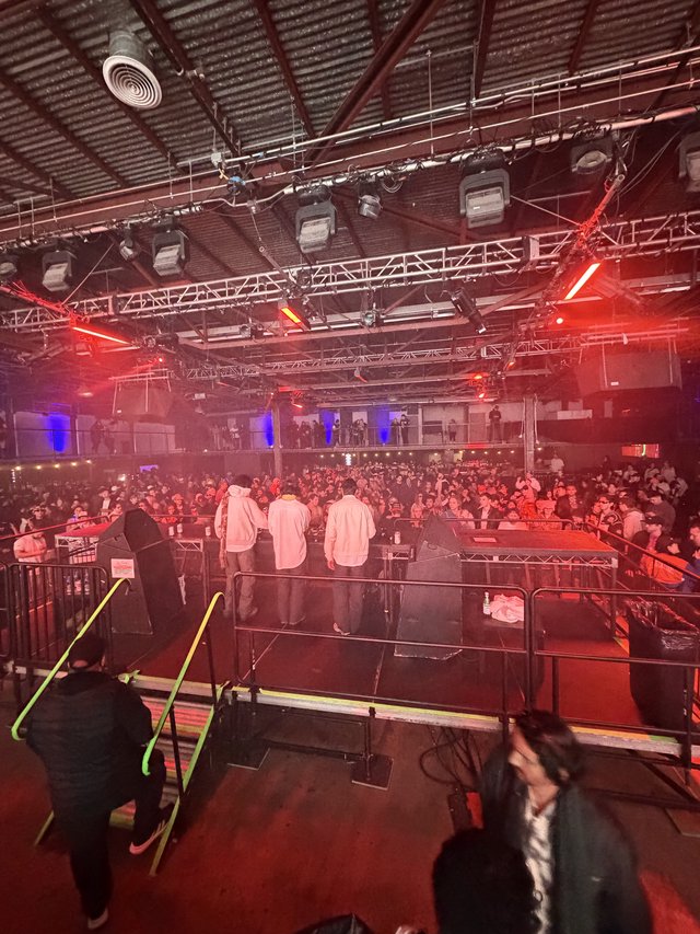 Electronic Music Event: Backstage View of Packed Venue