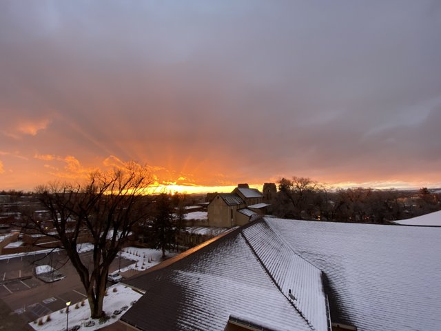 Snowy Sunset Over Santa Fe Roof