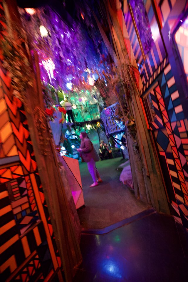 Kaleidoscopic Journey Through Illuminated Corridor