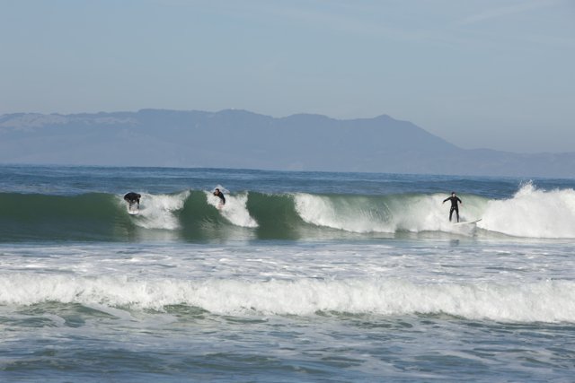 Dynamic Trio Surfing the Pacifica Waves
