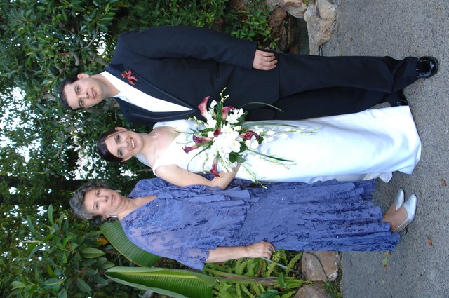 Bride and Groom Pose with Family at Wedding