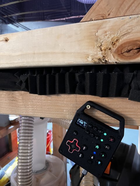 Remote Control on Wooden Beam