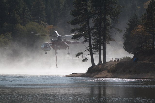 Helicopter Fighting Fire Above Lake