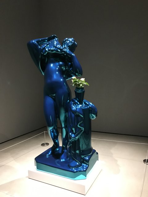 The Blue Statue with a Plant