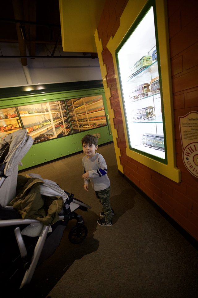Young Child Explores Train Museum Display