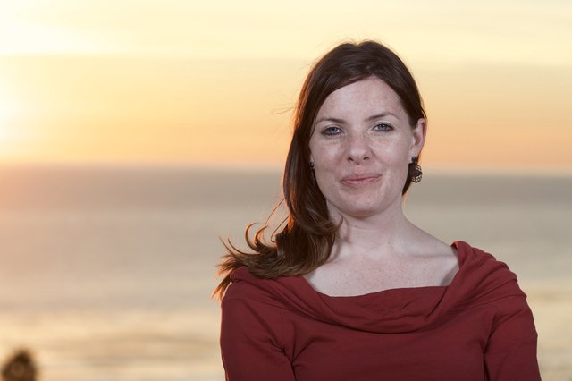 Woman in Red at Golden Hour Ocean Sunset
