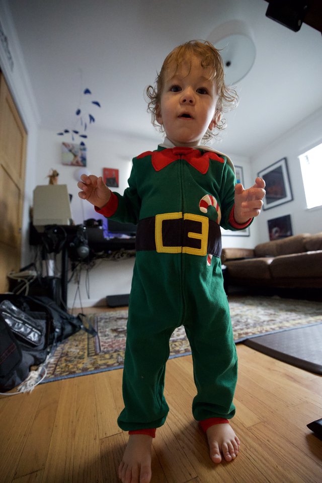 Toddler in Festive Elf Costume at Home