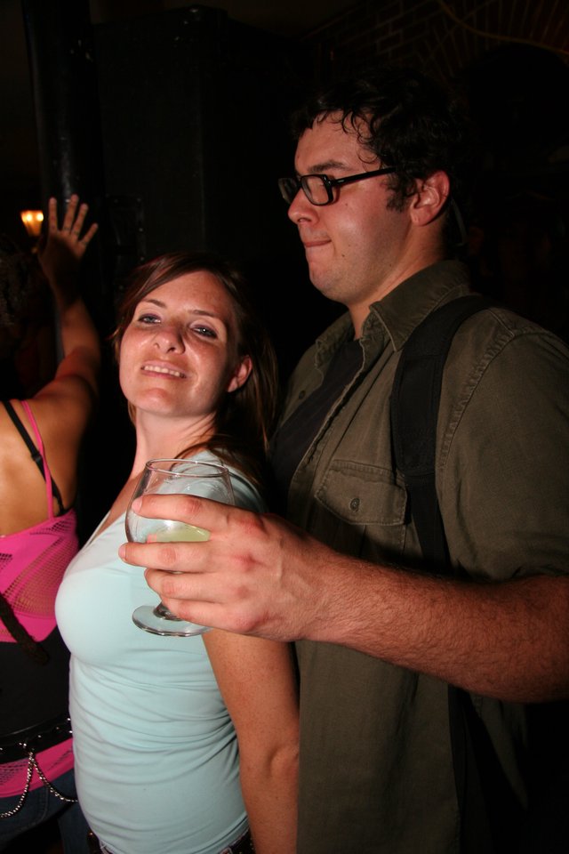 Couple Sharing a Drink at a Nightclub Party