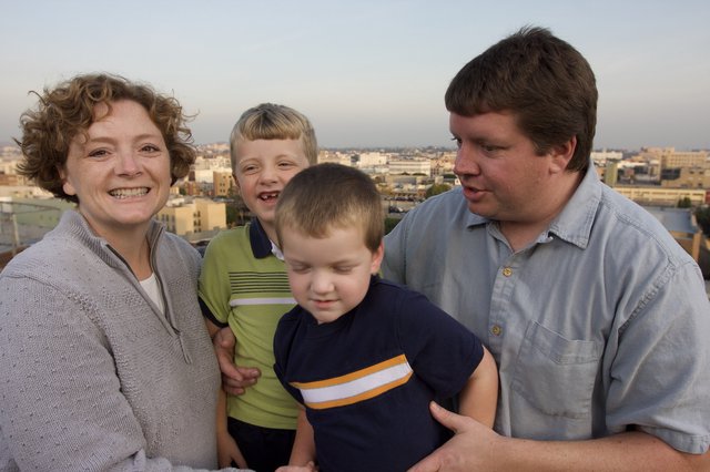 Family Portrait on Urban Rooftop at Dusk