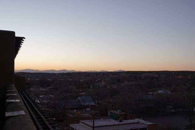 A Cityscape of Peaks from a Rooftop