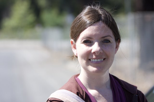 Smiling Woman Outdoors in Warm Natural Light