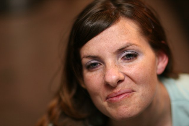 Candid Portrait of a Woman with a Knowing Smirk