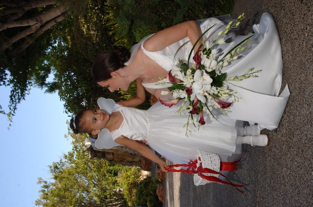 Bride and Flower Girl Share a Tender Wedding Moment