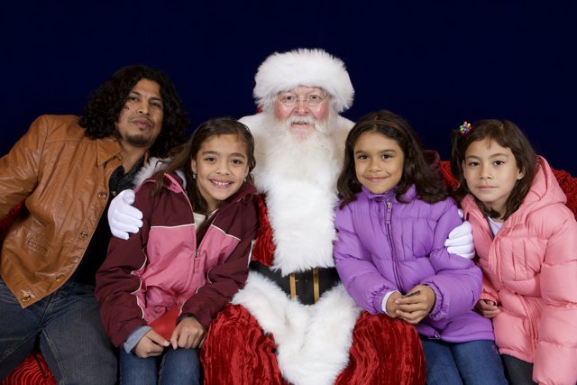 Santa Claus Spreading Joy to Children at APC Xmas Party