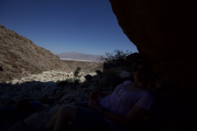 Desert Shade: Resting Under Canyon Rocks in Death Valley