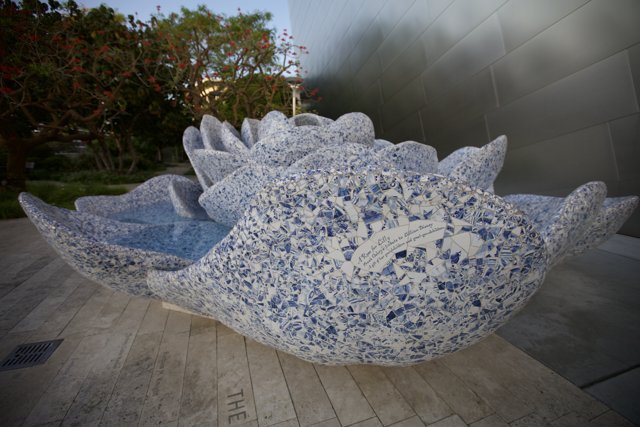 Blue and White Porcelain Sphere on Flagstone Floor
