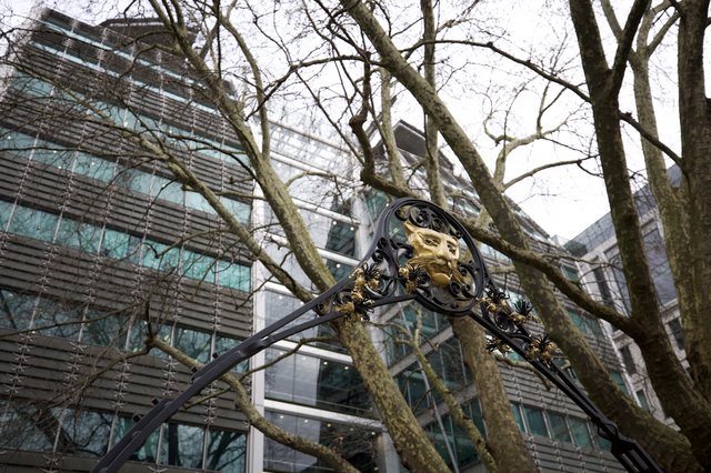 Ornate Victorian Lamppost Against Modern London Architecture
