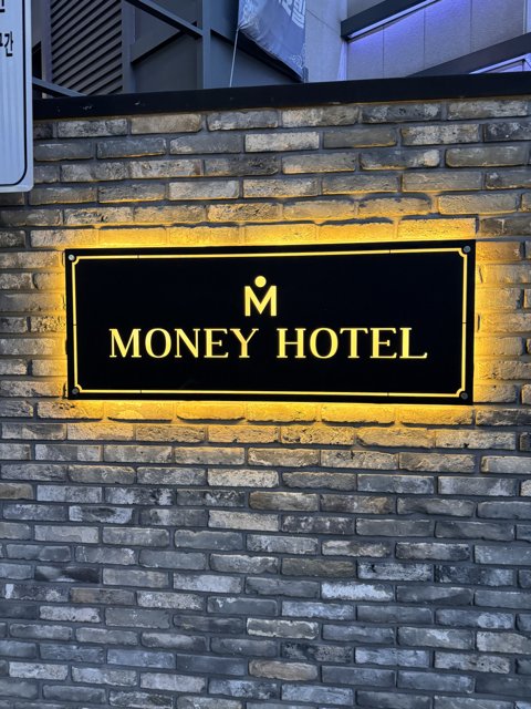Brick-Bound Wonders: The Money Hotel Sign