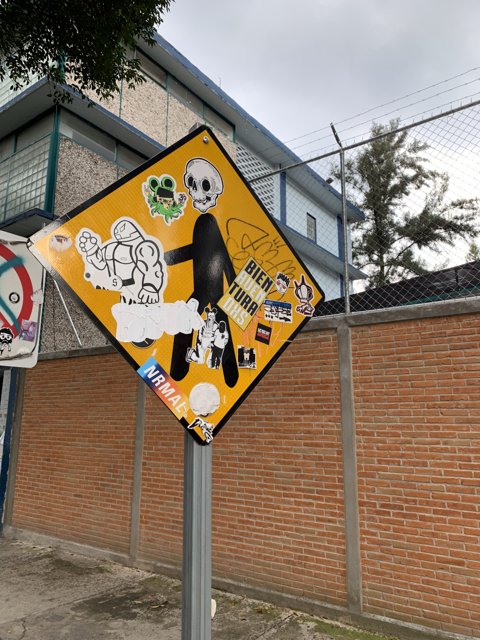 Stickered Street Sign