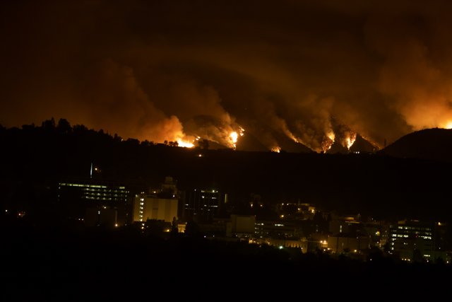 Flames Engulf the Hills Above the City